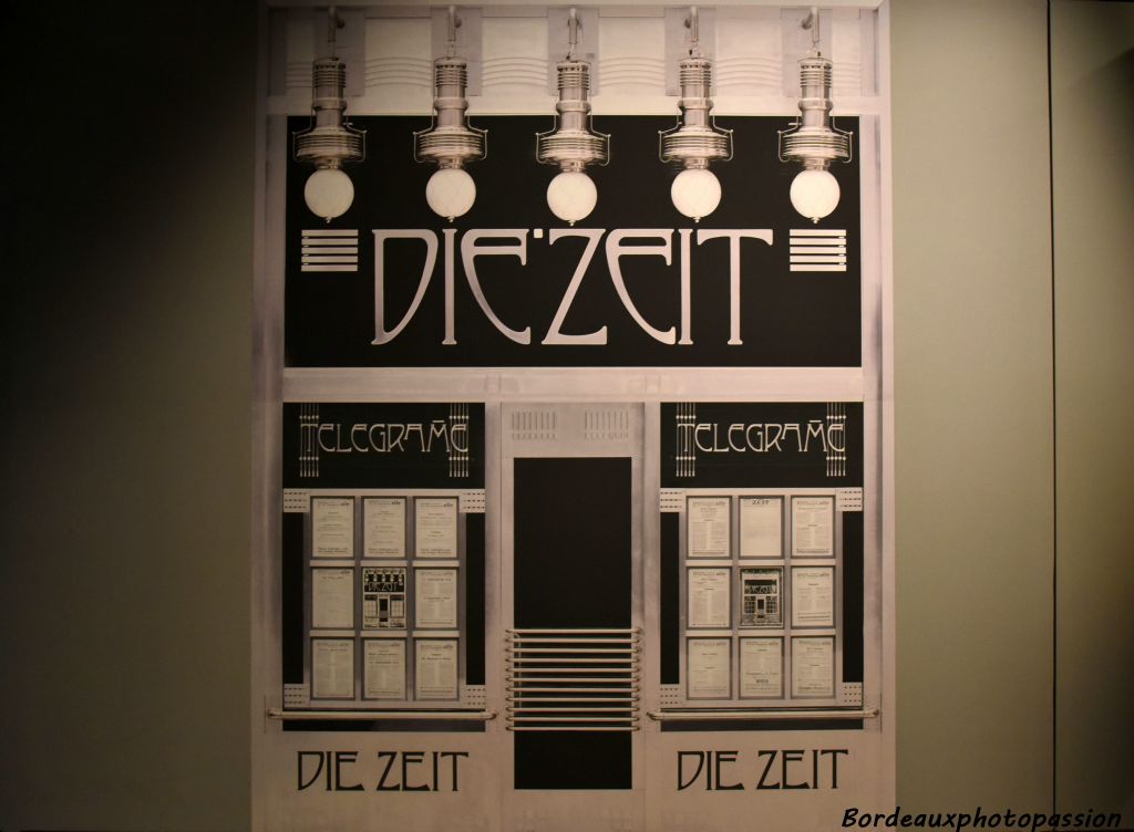 En 1902, Otto Wagner réalise le bureau des dépêches du journal Die Zeit. Une série de 5 lampes éclairent le nom du journal écrit dans une typographie mise au point par l'architecte.
